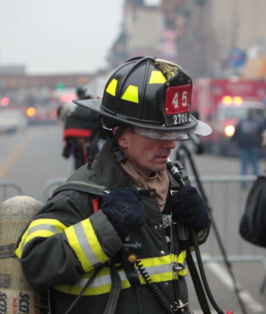 Firefighter walking in New York City - On March,12,2014: An Explosion In NYC