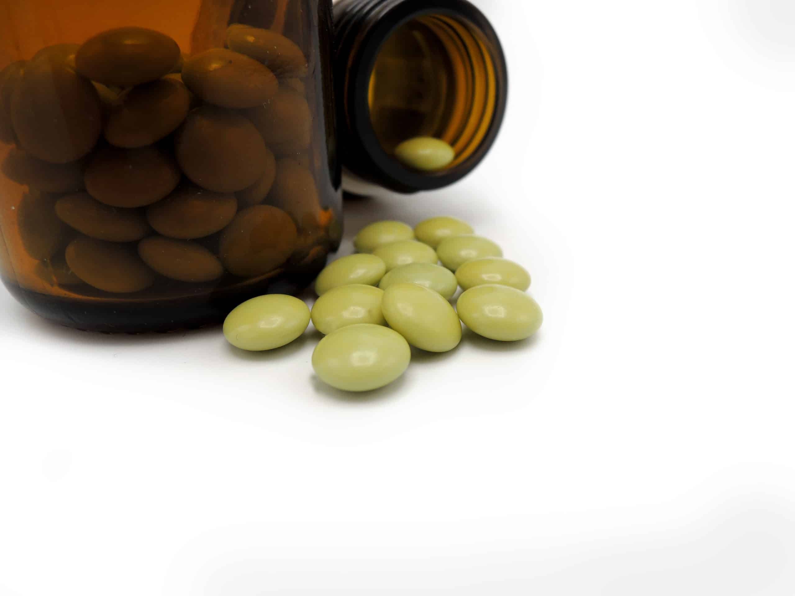 An Opened Bottle Of Green Tablets Of Chlordiazepoxide And Clindinium which causes Benzo Abuse