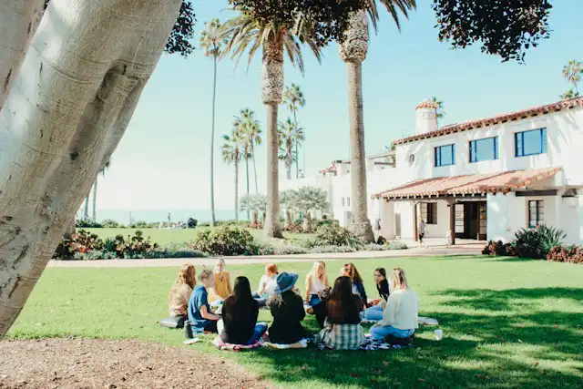 A group of people sitting in a circle as part of community network